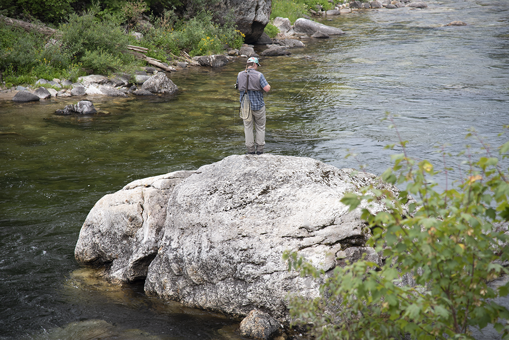 Deep water swirls around a huge boulder, creating ideal westlope cutthroat habitat.