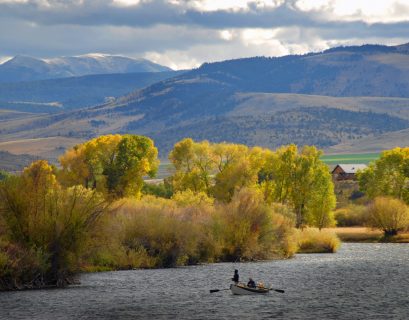 Fly fisherman on a drift boat on a Montana river