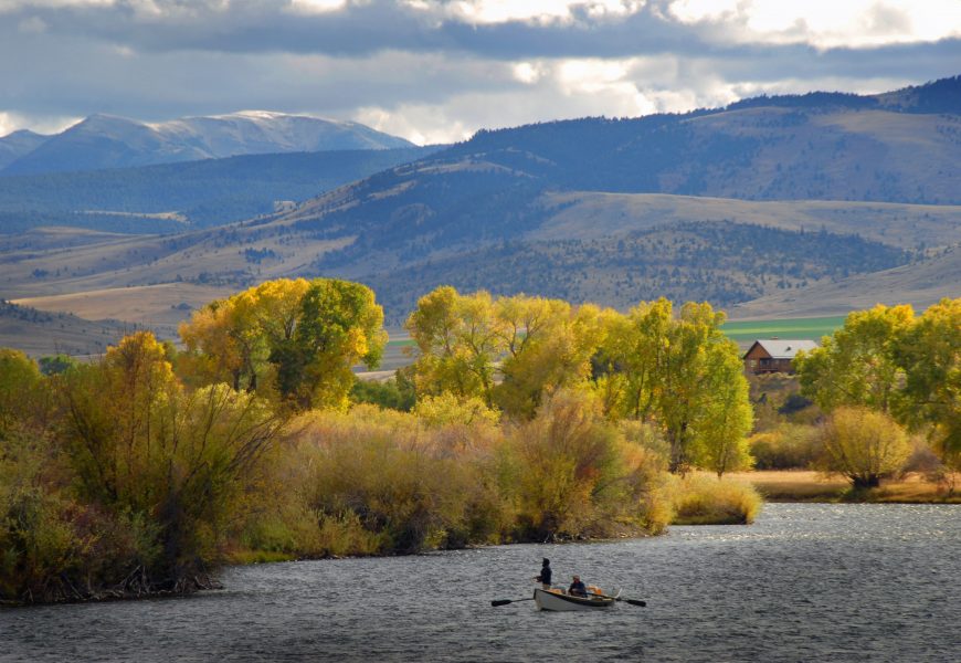 Fly fisherman on a drift boat on a Montana river